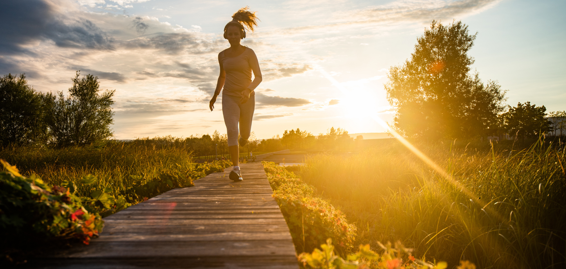 Person meditating peacefully outdoors on a yoga mat